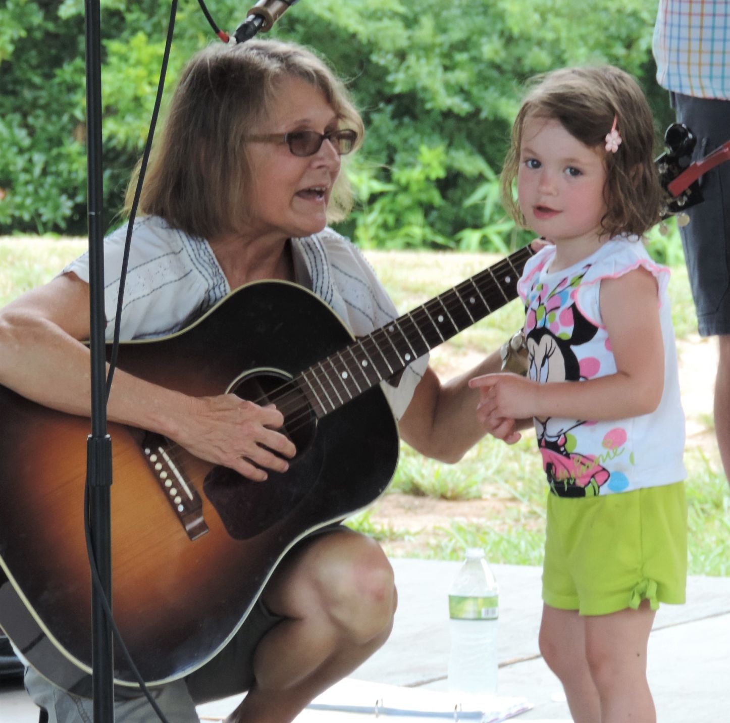 Mary Ervin and impromptu guest Lilli Woodie sing The Wheels on the Bus. Lilli saw Butterbeans with mom Brandy Woodie..JPG